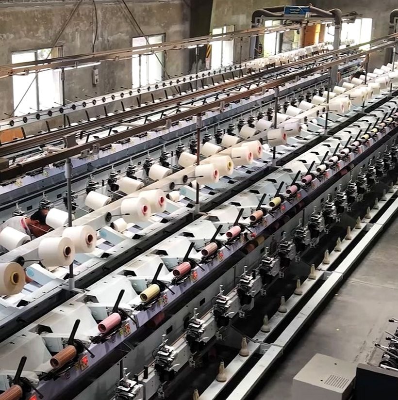 Yarn-winding machines at the Link Up Textiles fabric mill, Salem